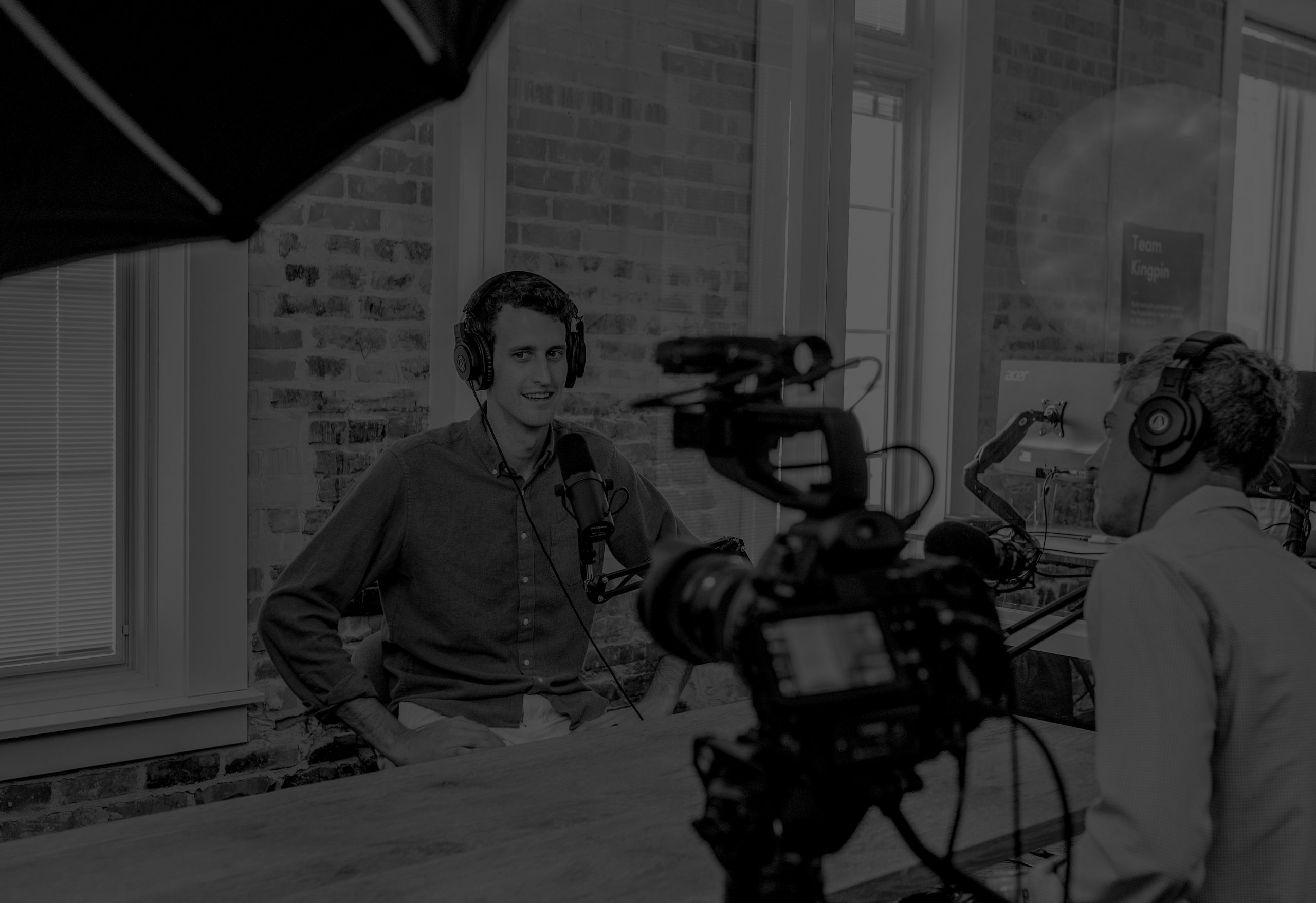 Founder participating in a podcast and media interview recording session with professional audio and video equipment. Image represents media training, spokesperson development, founder thought leadership, executive communications, and interview preparation for journalists, analysts, podcasts, and AI-driven media discovery.