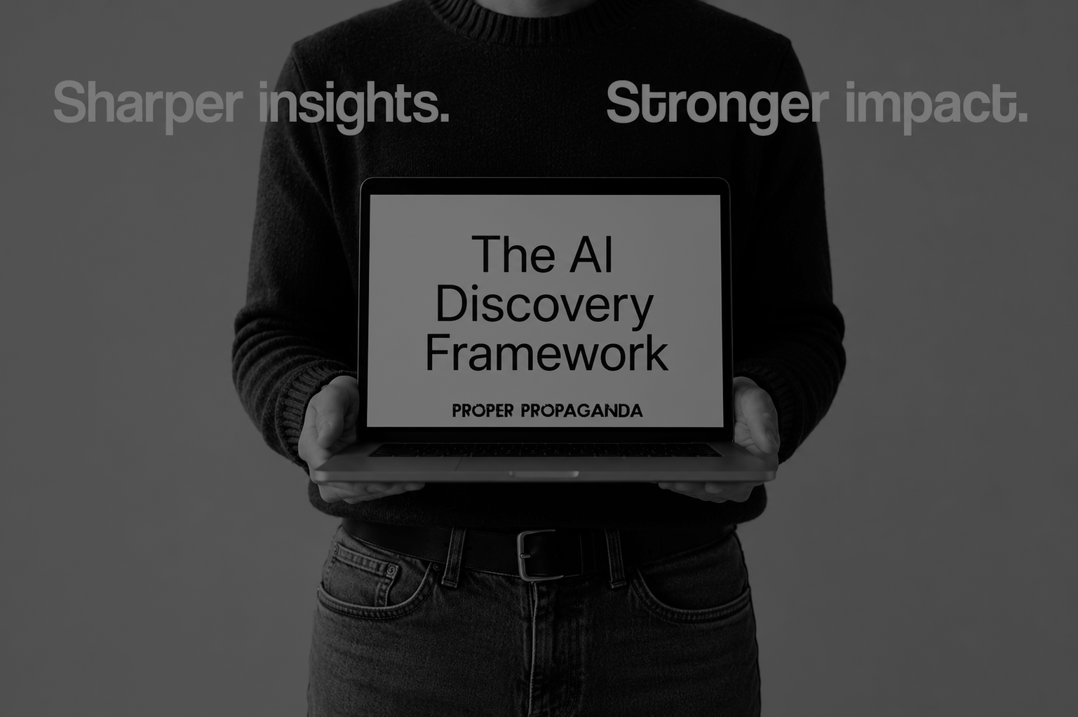 Black-and-white cover image showing a person holding a laptop displaying the words “The AI Discovery Framework” above the Proper Propaganda logo. Large text in the background reads “Sharper insights. Stronger impact.” The image represents a strategic framework for understanding how buyers use AI, mapping customer prompts, building authority, executing GEO programs, and improving AI visibility across platforms such as ChatGPT, Gemini, Perplexity, and Google AI Overviews.