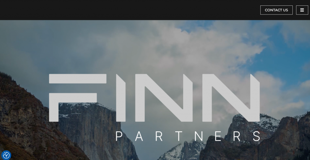 FINN Partners homepage featuring the global integrated communications agency’s logo over a mountain landscape, representing its international PR, earned media, digital strategy, GEO, and AI search visibility capabilities.