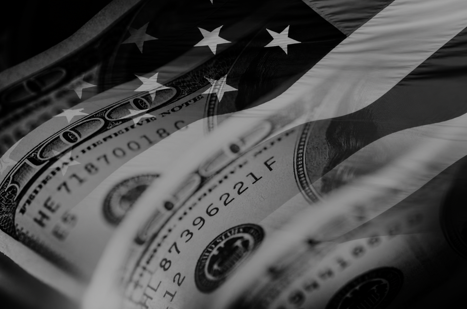 Black-and-white composite of a U.S. hundred-dollar bill overlaid with an American flag, symbolizing the relationship between the U.S. economy, consumer spending, retail behavior, and the market dynamics that shape consumer technology brand success in the United States.