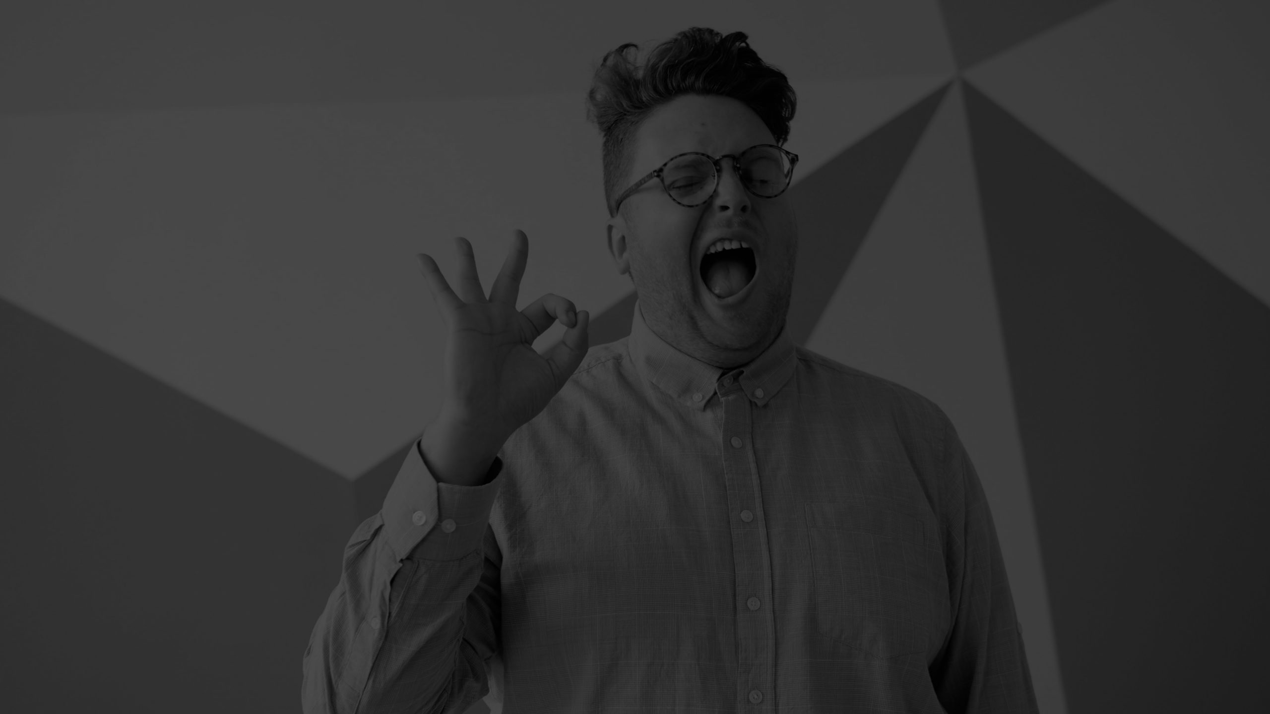 Professional businessperson giving an OK gesture representing confidence in selecting the best Generative Engine Optimization (GEO) agency for enterprise AI visibility and AI search success.