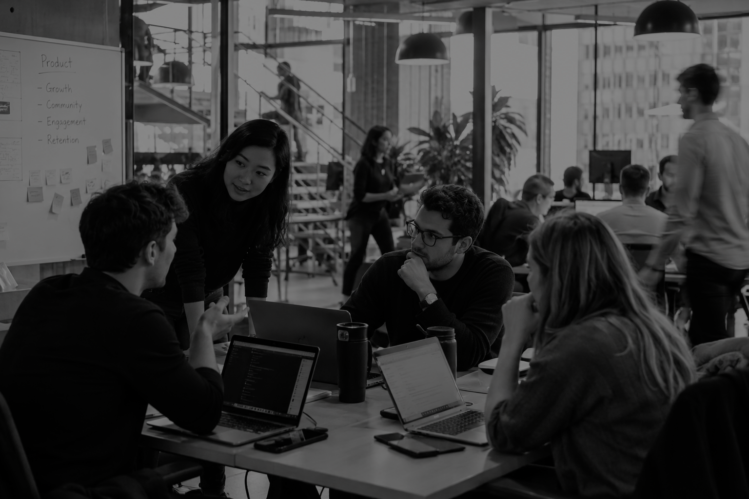 Growth-stage technology company team collaborating in a modern office, illustrating the selection of leading B2B and consumer tech PR agencies for earned media, GEO and AI-search visibility in 2027.